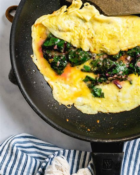 omelette-with-beet-greens-recipe-a-couple-cooks image