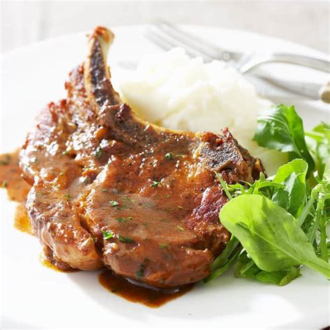 cider-braised-pork-chops-cooks-country image