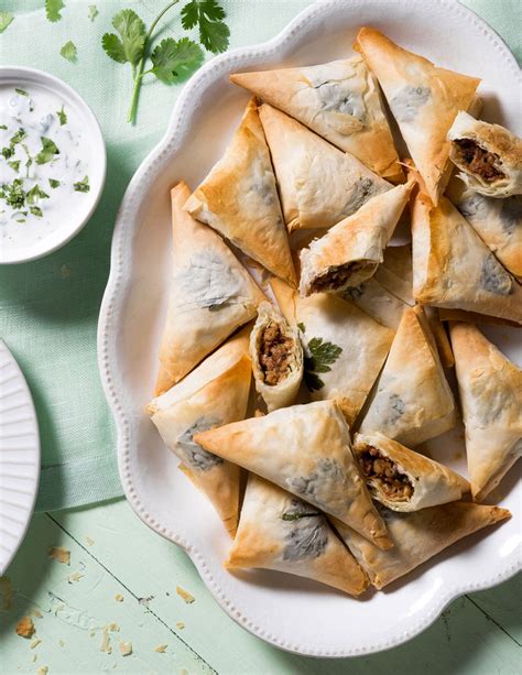 chicken-phyllo-triangles-with-walnuts-dates-and-feta image