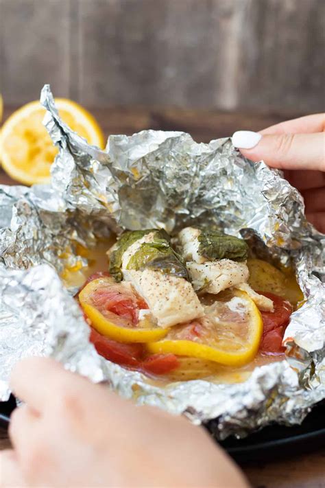 baked-cod-in-foil-with-tomatoes-potatoes-lemon image