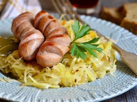 sausages-with-sweet-and-sour-caraway-cabbage image