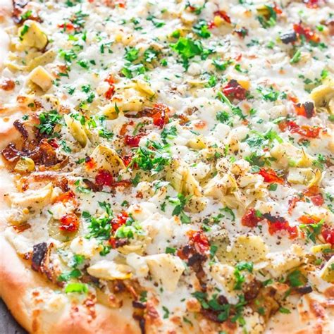 artichoke-sun-dried-tomatoes-and-goat-cheese-pizza image