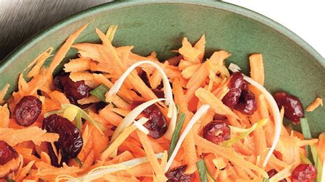 carrot-and-cranberry-salad-with-fresh-ginger-dressing image