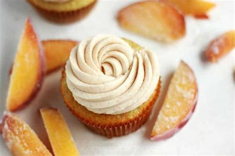 peach-cupcakes-with-cinnamon-frosting-one-sweet image