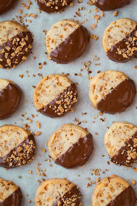 chocolate-dipped-toffee-pecan-shortbread-cookies image