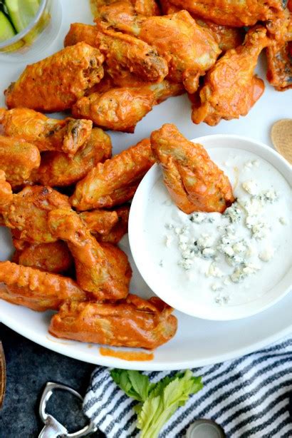 spicy-garlic-chicken-wings-and-blue-cheese-dip-tasty image