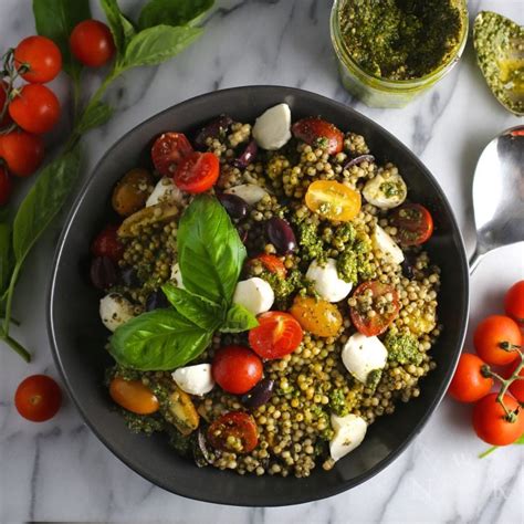 pesto-couscous-salad-with-mozzarella-and-tomatoes image