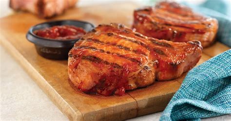 grilled-ribeye-rib-pork-chops-with-easy-spicy-bbq-sauce image