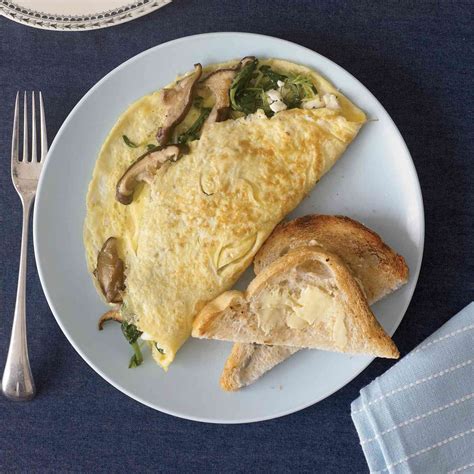 wild-mushroom-and-goat-cheese-omelets-recipe-neal image
