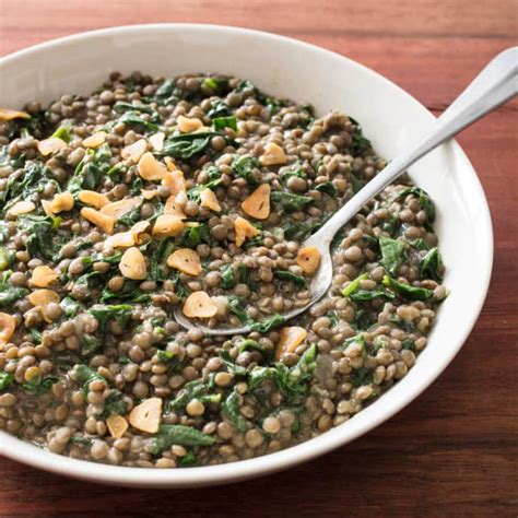 lentils-with-spinach-and-garlic-chips-americas-test image