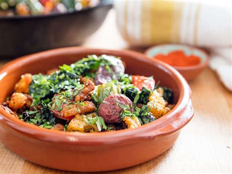 spanish-style-migas-with-chorizo-peppers-and-kale image