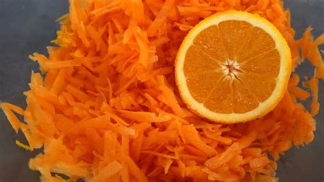 grated-carrot-and-orange-salad-recipe-yummy-inspirations image