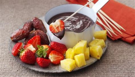 chocolate-fondue-with-fruit-platter-recipe-bbc-food image