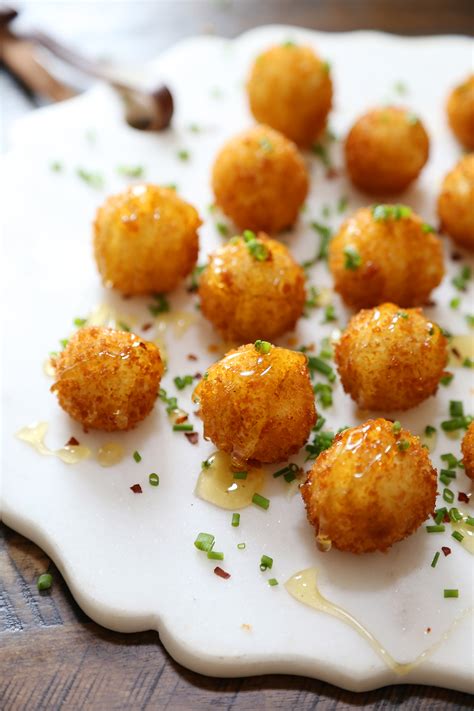 crispy-goat-cheese-poppers-with-honey-the-comfort image