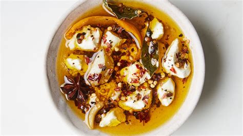 marinated-goat-cheese-with-herbs-and-spices image