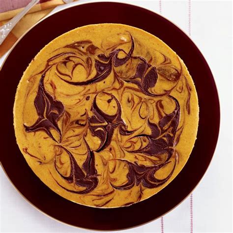 marbled-pumpkin-cheesecake-with-a-brownie-crust image