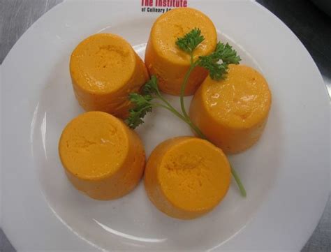 carrot-and-cheese-timbales-with-red-pepper-sauce image