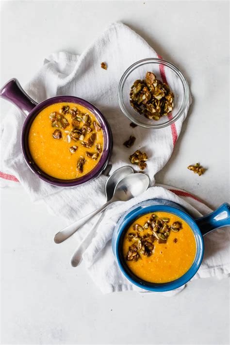 vegan-butternut-carrot-bisque-with-curried-pepita-brittle image