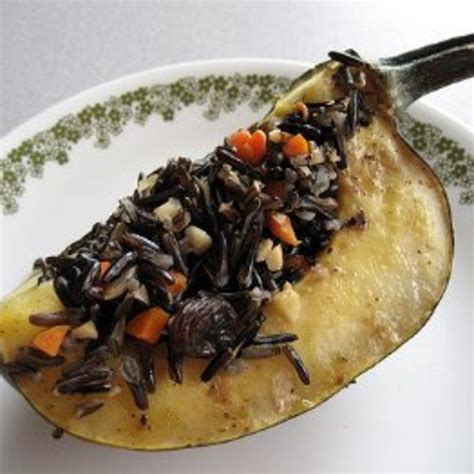 acorn-squash-stuffed-with-wild-rice-hazelnuts image