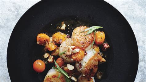 scallops-with-hazelnuts-and-warm-sun-gold-tomatoes image