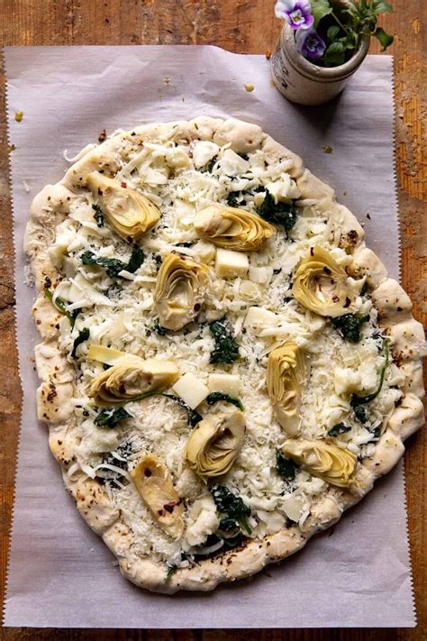 spinach-and-artichoke-pizza-with-cheesy-bread-crust image