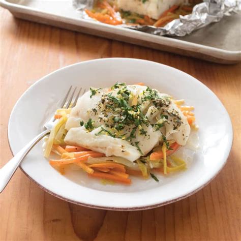 cod-baked-in-foil-with-leeks-and-carrots-americas-test image