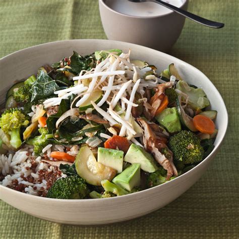 quinoa-and-brown-rice-bowl-with-vegetables-and-tahini image