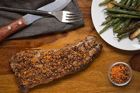 herbed-garlic-pepper-rubbed-new-york-strip-steaks image