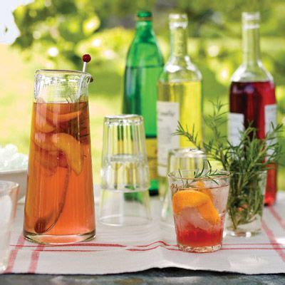 peach-and-rosemary-spritzers-recipe-delish image