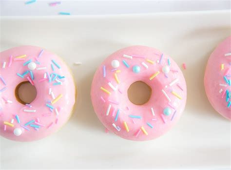 fluffy-baked-donuts-with-pink-frosting-and-sprinkles image