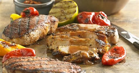 spicy-grilled-bbq-pork-chops-recipe-yummly image