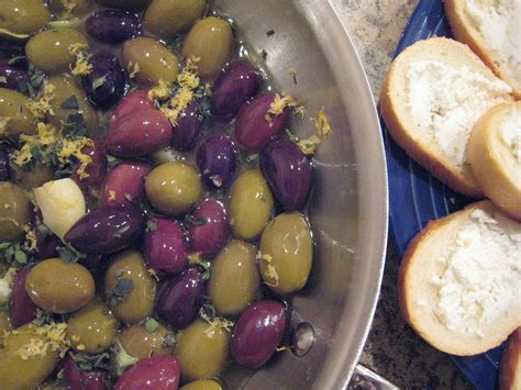 oil-cured-olives-baked-with-white-wine-and-garlic image