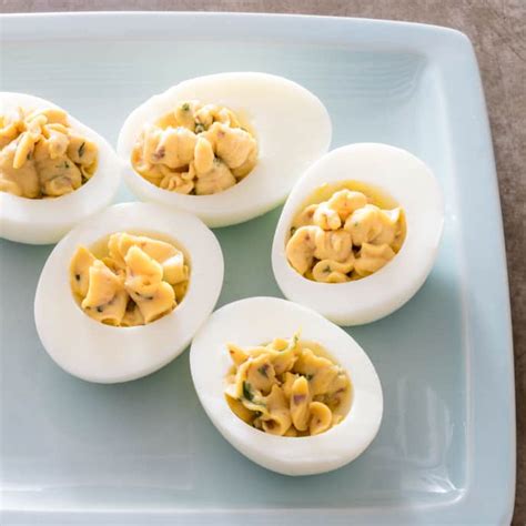 deviled-eggs-with-anchovy-and-basil-americas-test image
