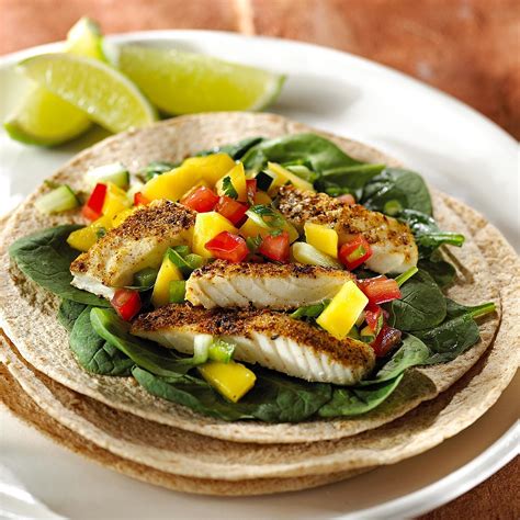 fish-tacos-with-mango-salsa-recipe-eatingwell image