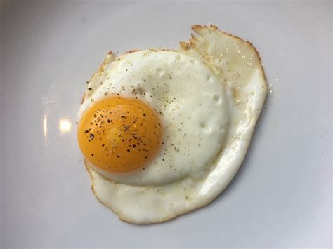 how-to-fry-an-egg-perfectly-every-time-spoon image