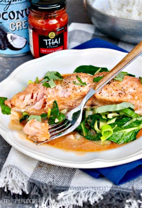 salmon-coconut-curry-sauce-over-sauted-spinach image
