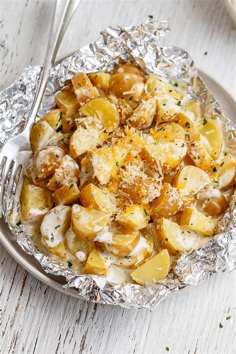 baked-potatoes-in-foil-packets-with-parmesan-ranch-sauce image