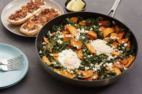 sweet-potato-kale-hash-with-baked-eggs-ricotta image