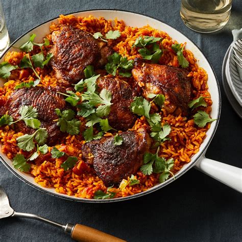 one-skillet-chicken-with-tomato-and-turmeric-rice image