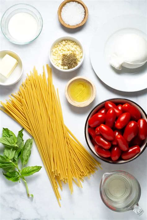 pasta-with-tomatoes-and-garlic-white-wine-sauce image