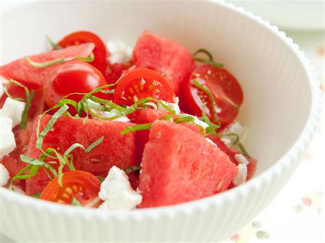 watermelon-salad-with-tomatoes-goat-cheese-and-basil image