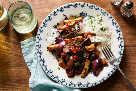 chinese-peruvian-beef-stir-fry-with-french-fries-lomo image