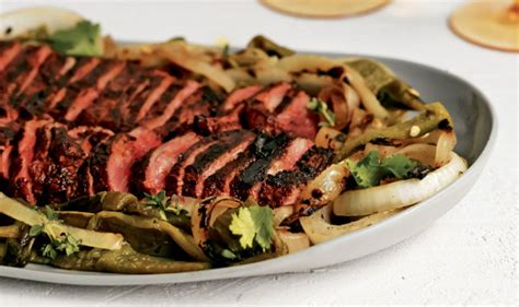 grilled-skirt-steak-with-poblano-peppers-and-onions image