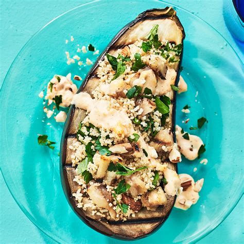 stuffed-eggplant-with-couscous-almonds-eatingwell image