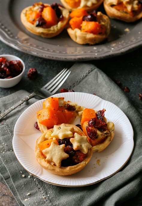 butternut-brie-and-cranberry-tartlets-with-rosemary image