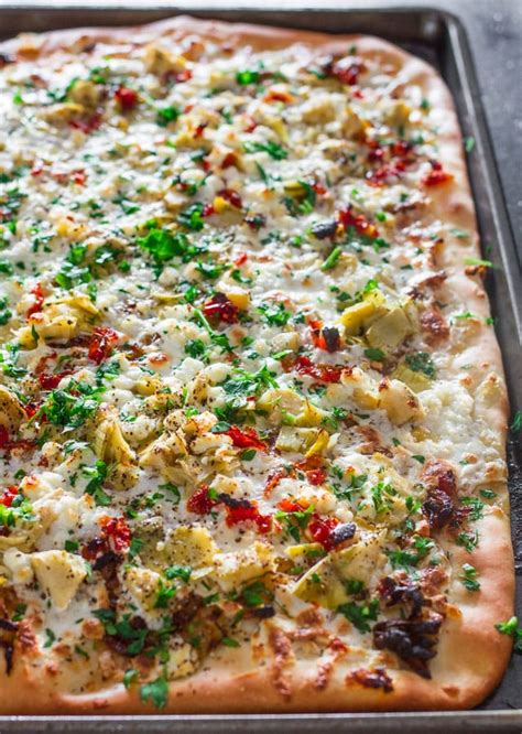 artichoke-sun-dried-tomatoes-and-goat-cheese-pizza image
