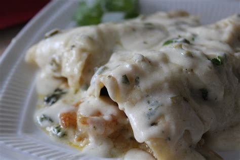 shrimp-and-spinach-enchiladas-with-jalapeno-cream-sauce image