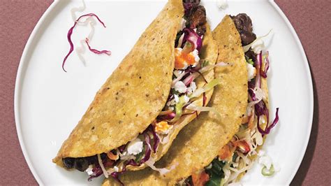 crispy-black-bean-tacos-with-feta-and-cabbage-slaw image