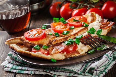 tomato-cheese-and-bacon-omelette-recipe-recipesnet image