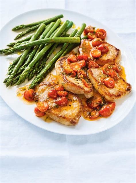 seared-pork-chops-with-wilted-tomatoes-ricardo image